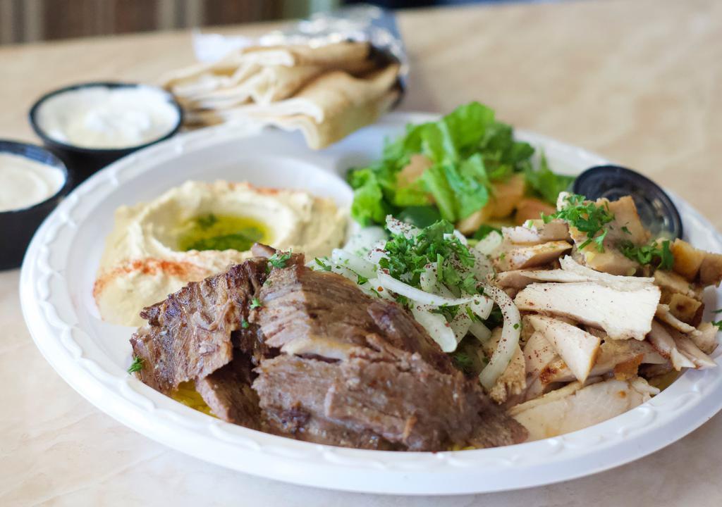 Shawarma Mix Plate · This combo comes with both the chicken and tri-tip Shawarma and served with sides of garlic and tahini.