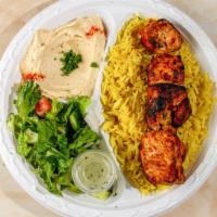 Half Chicken Kabab Plate · Three Cubes of chicken breast served with salad, hummus, rice, and pita bread.
