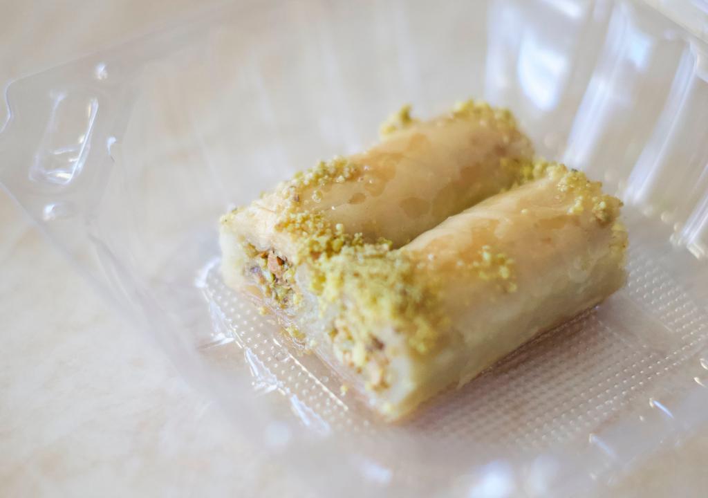 Baklava · Two pieces of thin layers of filo pastry with pistachio and honey.