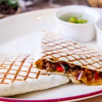 The World Famous Steak Quesadilla Quesadilla · Juicy, grilled steak, grilled onions, sautéed bell peppers, Monterey jack, cheddar, asadero ...