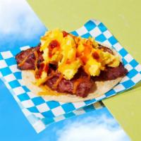 Pastrami Breakfast Taco · Eggs, pastrami, melted cheese, salsa.