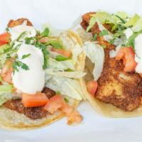 Fish Taco (Large Only) · Large fish taco prepared fried or grilled topped with cabbage, onions, cilantro, tomato and ...