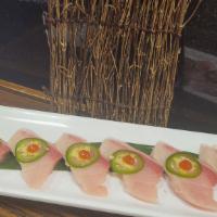 Yellowtail Carpaccio · 6 pcs fresh yellowtail sashimi
Top: Slices of jalapeno, a dot of sriracha, yuzu ponzu and tr...