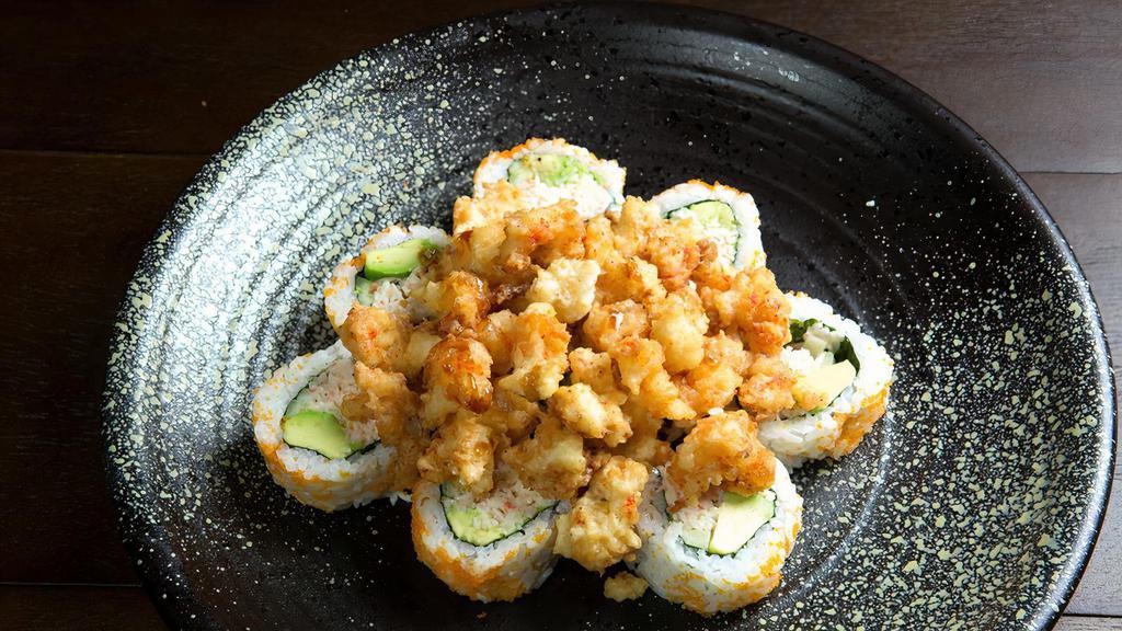 Popcorn Lobster · In: Crab meat and avocado. Top: Fried crawfish, masago, green onion, and eel sauce.