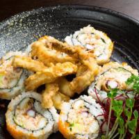 Calamari Tempura · In: Crab meat, avocado, and fried calamari. Top: Masago and eel sauce.