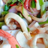 Yum Ruam Mitr · mixed seafood onions, tomato, celery with lime and chili sauce.