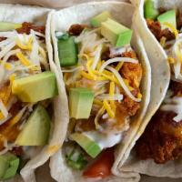 Tacos · tender with tacos topped with pico de gallo, avocado, cilantro, lime and sauce