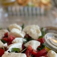 Organic Arugula Caprese Salad · Arugula, fresh cherry tomatoes, olive oil and Fresh Bufala mozzarella From Italy.