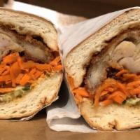 Lemongrass Chicken Banh Mi Sandwich · Grilled lemongrass chicken, jalapenos, pickled carrots, daikon, cucumbers, cilantro, and aio...