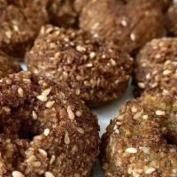 Falafel · Fried patty made from ground marinated chickpeas, garlic, cumin, celery.