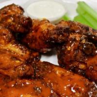 Baked Hot Wings · Nine chicken wings rubbed with our secret house seasoning and oven-baked to perfection, toss...