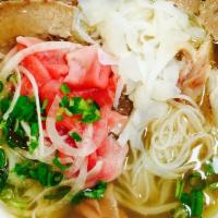 Special Beef Noodle Soup / Phở Đặc Biệt · Combination of thin sliced rare steak, brisket, tripe, tendon, meat ball, cilantro, and onion.