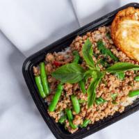 Kapow · Stir-fried ground chicken or pork with green beans with basil sauce over rice.