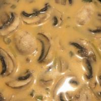Tom Kha (Coconut Milk Soup) · Mushroom, onion, cilantro, lemongrass, kaffir leaves, tomatoes onion and galangal in the coc...