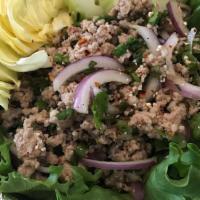 Larb · Grounded chicken or pork, green onion, red onion, cilantro and rice powder  mixed with fresh...