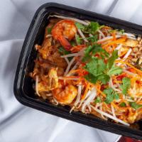 Pad Thai · Stir-fried rice noodle with meat, egg, onion, and bean sprouts served with ground peanut.