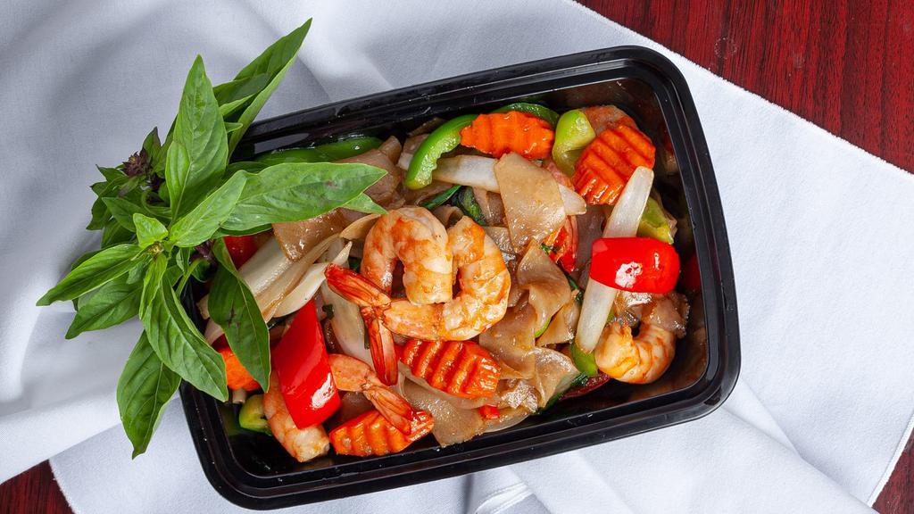 Drunken Noodle · Stir-fried flat noodles with chili, garlic, onion, bell pepper, carrot, and basil leaves.