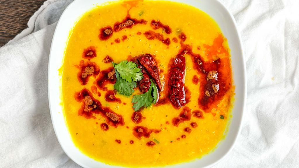 Yellow Daal · Sauteed in a wok with onions tomato ginger garlic and spices.