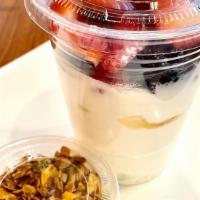Yogurt + Granola · Plain yogurt with fresh berries, honey and house-made granola.