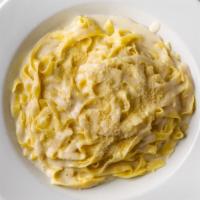 Fettuccine Alfredo · Flat slender noodles sauteed in a rich cream sauce.