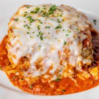 Lasagna Al Forno · Layers of tender noodles baked with ground beef, spinach and cheese topped with marinara sau...