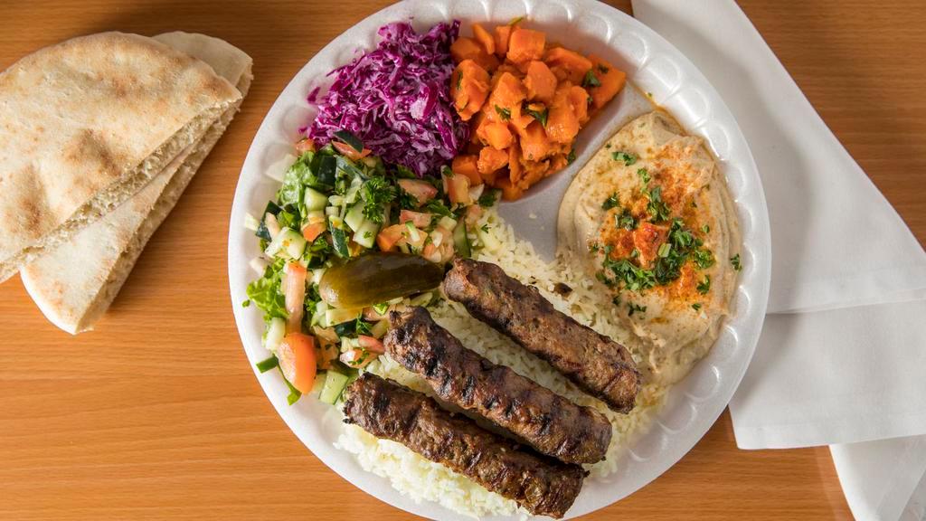 Beef Kabob Plate · Served with ground beef kabobs, Mediterranean sides (5), a freshly-baked pita bread, and your choice of sauces.