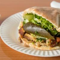 Shawarma Sandwich · Prepared in a freshly-baked pita bread, filled with shawarma (chicken, lamb & turkey, or mix...