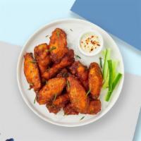 Classic Chix Wings · Fresh chicken wings breaded and fried until golden brown. Served with a side of ranch or ble...