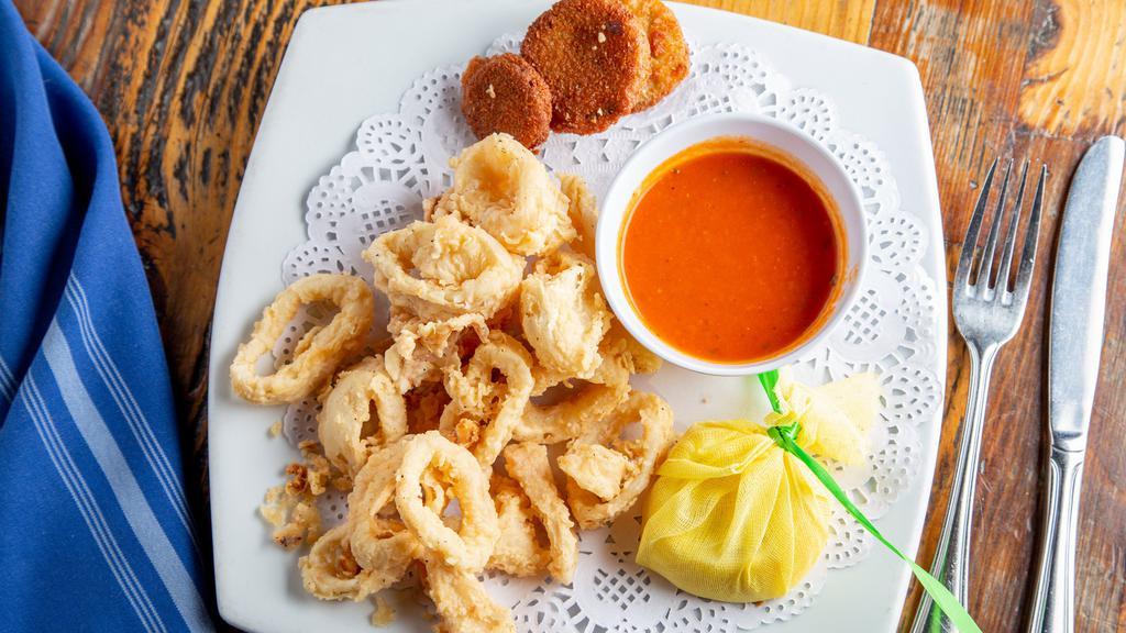 Calamari & Zucchini Fritti · Deep fried calamari and Italian squash, served with marinara sauce.