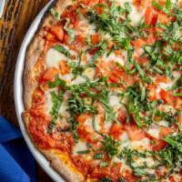 Pizza Margherita · Tomato sauce, mozzarella cheese and basil.