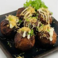 Takoyaki (4 Pieces) · Octopus dumplings with bonito flakes, Japanese mayo and takoyaki sauce.