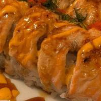 Baked Salmon Roll · In: Crab Meat, Cream Cheese, Avocado and Cucumber. Top: Baked Salmon, Masago and Green Onion...