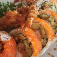 Spider Roll · In: deep fried soft shell crab, crab meat, avocado, cucumber and gobo. Top: masago. Sauce: e...