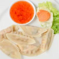 Vegetable Dumplings · Cabbage, onion and mushroom dumplings with pickled cabbage and carrots served with a vinegar...