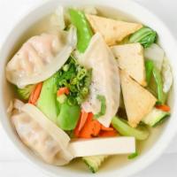 Wonton Soup · An all time classic-wontons, loads of fresh vegetables, cilantro, and tofu simmered in a lig...