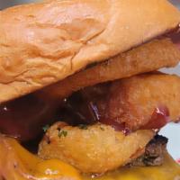 The Big Texas · Savory Applewood Bacon, Beer Battered Onion Rings with a sweet and tangy BBQsSauce and Chedd...