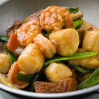Claypot Seafood Tofu · Shrimp, scallop, fish fillet, tofu, & seasonal vegetables simmered in a rich brown sauce.