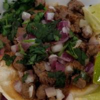 Street Taco · Double small corn tortilla, choice of meat, cilantro and onions.