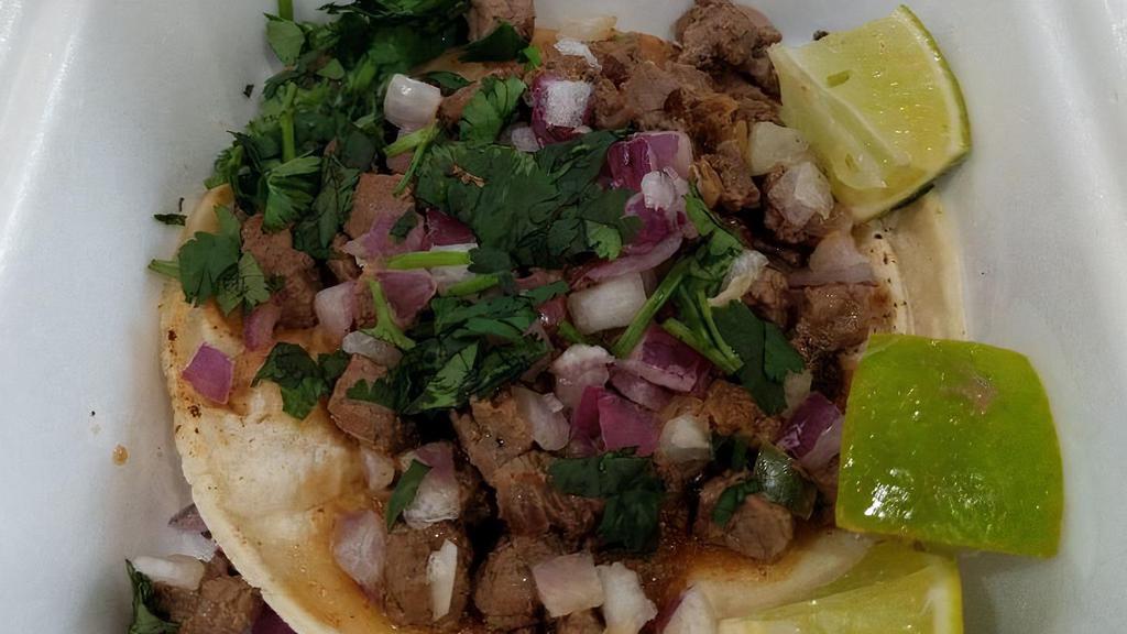 Street Taco · Double small corn tortilla, choice of meat, cilantro and onions.