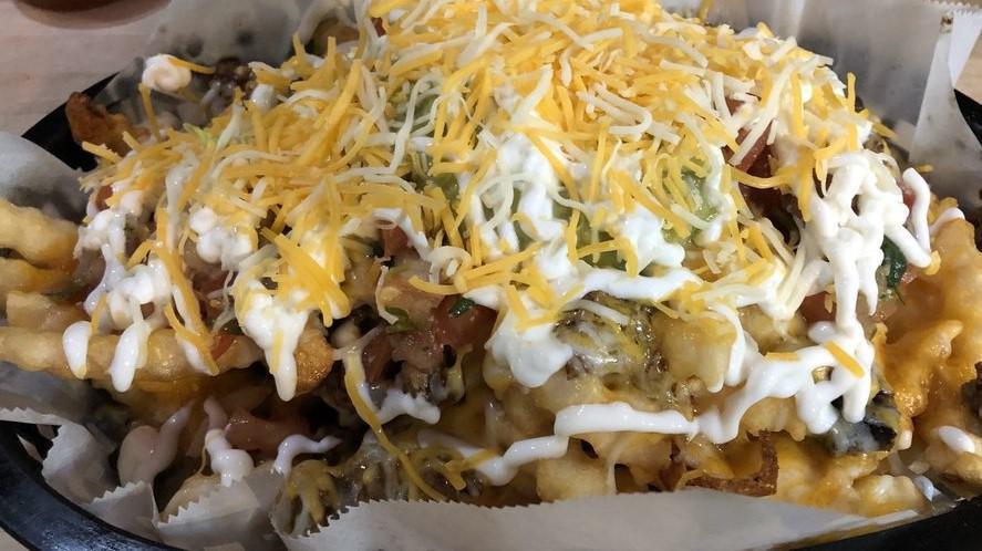 Chita’S Fries · Fries topped with choice of meat, melted cheese, guacamole, sour cream and pico de gallo.