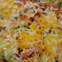 Super Nachos · Chips topped with choice of meat, melted cheese, beans, guacamole, sour cream and pico de ga...