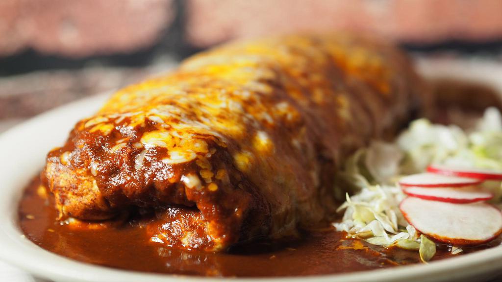 Mega Wet · Your choice of meat, beans, rice, fajita vegetables, cheese, guacamole, and sour cream. covered with enchilada sauce, and Melted cheese.