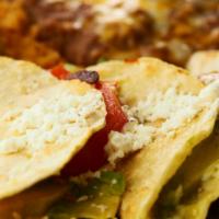 Enchiladas Suizas · Two enchiladas (chicken or cheese) topped with our homemade 