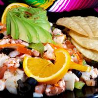 Ceviche Azteca · Tilapia and shrimp marinated in freshly squeezed lime juice, gently mixed with diced onions,...