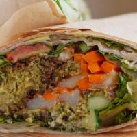 Falafel Veggie Wrap · Wrapped with romaine lettuce, tabbouleh, pickles and tahini. Vegetarian.