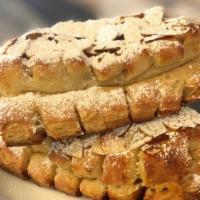 Bear Claw · House made dough filled with marzipan and topped with toasted almonds and powdered sugar.