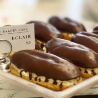 Eclairs · House-made eclair dough with a buttery cream filling, topped with chocolate ganache.