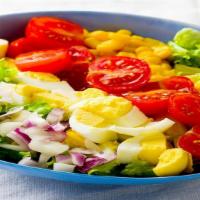 Cobb Salad · Locally grown mixed greens topped with creamy avocado, boiled eggs, turkey, Bleu cheese, sca...