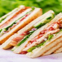 Original Club Sandwich · Juicy ham, turkey, crispy bacon, Swiss cheese, Cheddar cheese, fresh lettuce, tomatoes, mayo...