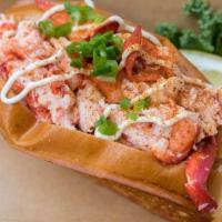 Connecticut Roll · Warm Maine lobster cooked in herb butter with a swipe of mayo topped with old bay and green ...